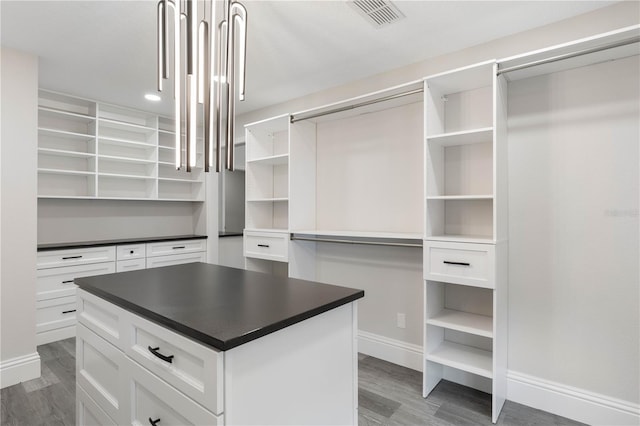 walk in closet featuring visible vents and light wood-style flooring