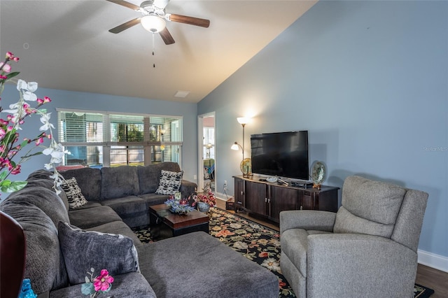 living area with high vaulted ceiling, ceiling fan, baseboards, and wood finished floors