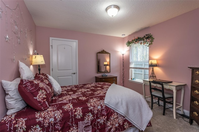 carpeted bedroom with a textured ceiling