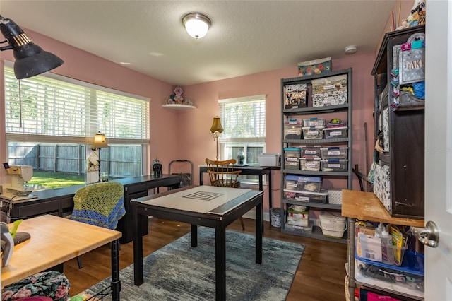 home office with a textured ceiling and wood finished floors