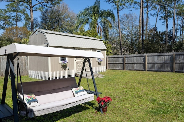 view of yard featuring an outbuilding and a fenced backyard