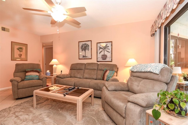 living area with light tile patterned floors, visible vents, and a ceiling fan