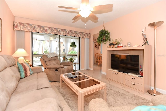 living room featuring ceiling fan and baseboards