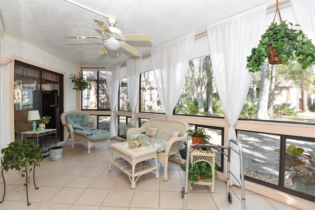 sunroom featuring ceiling fan