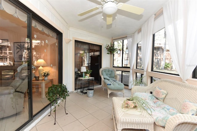 sunroom / solarium with a ceiling fan