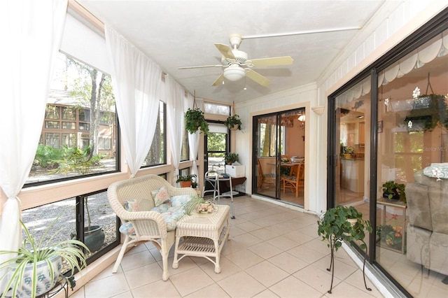 sunroom featuring a ceiling fan and a wealth of natural light