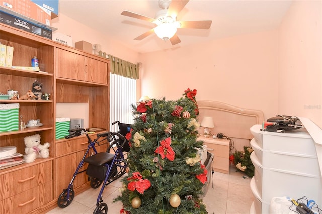 misc room with ceiling fan and light tile patterned flooring