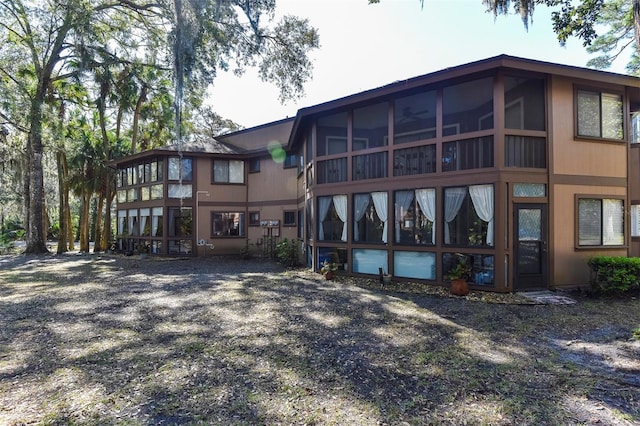 rear view of house with a sunroom