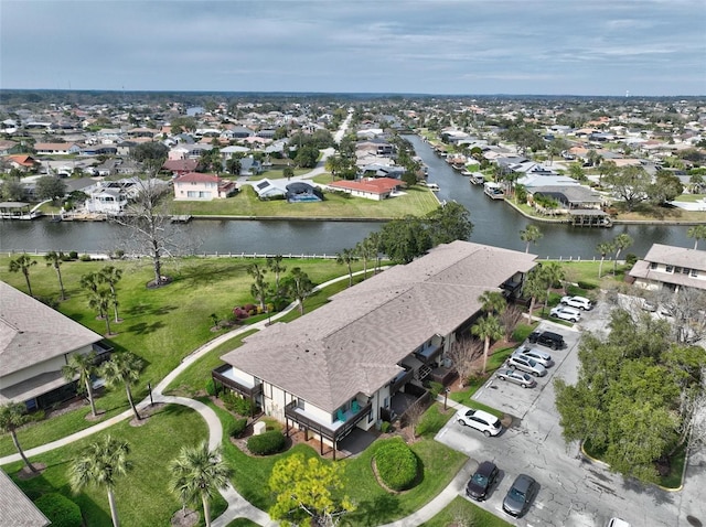 aerial view featuring a water view and a residential view