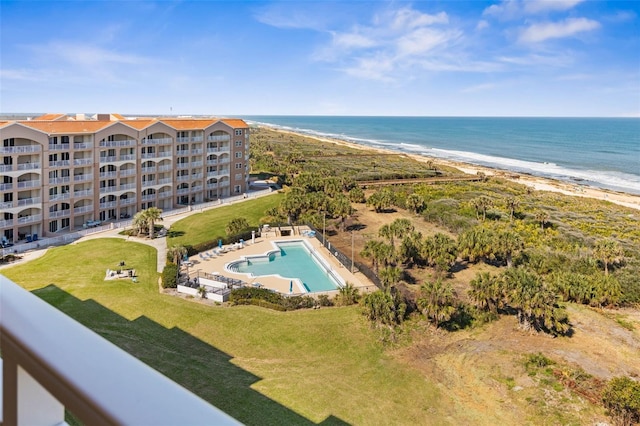 bird's eye view with a water view and a beach view