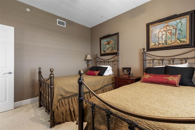 bedroom featuring carpet flooring, visible vents, and baseboards