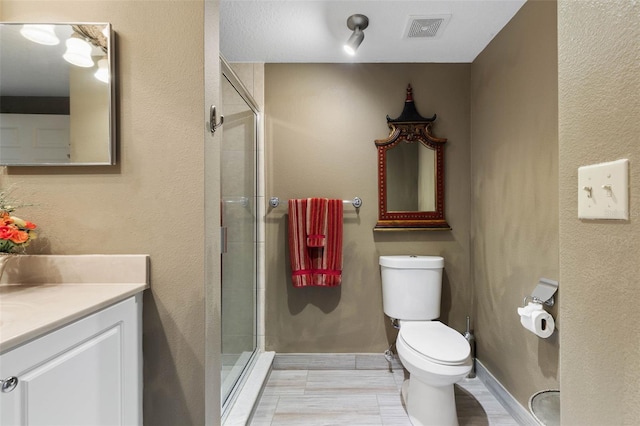 full bathroom featuring visible vents, toilet, a shower stall, and vanity