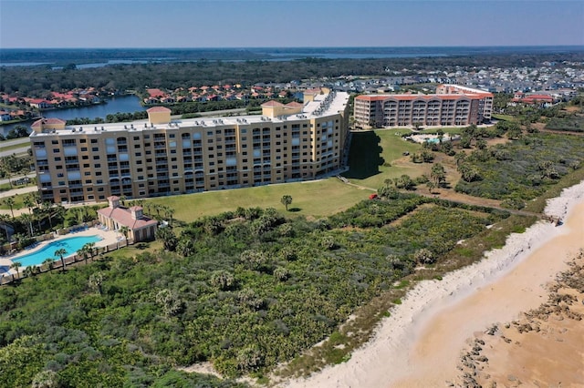 bird's eye view featuring a city view, a water view, and a beach view