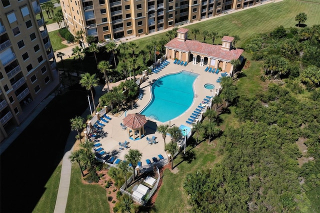 community pool featuring fence and a patio