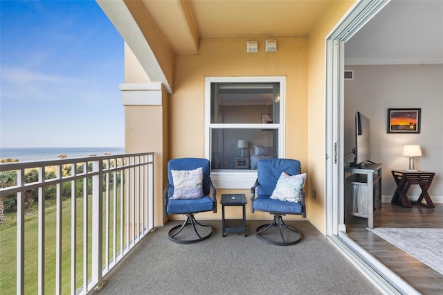 balcony featuring a water view