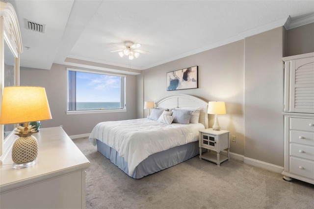 bedroom featuring visible vents, crown molding, and light carpet