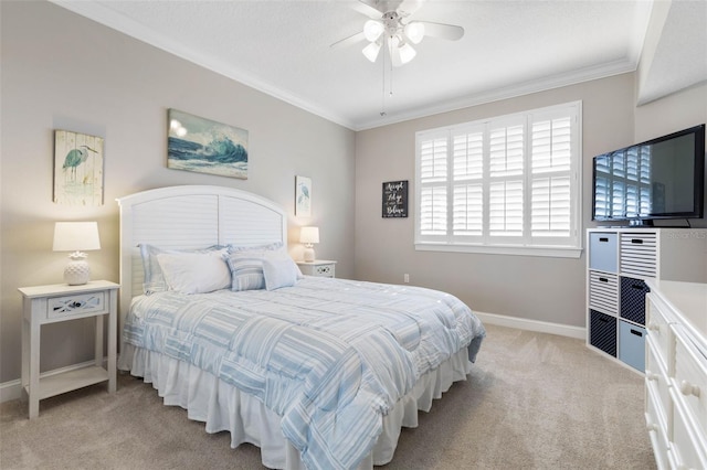 bedroom with ornamental molding, light carpet, baseboards, and a ceiling fan