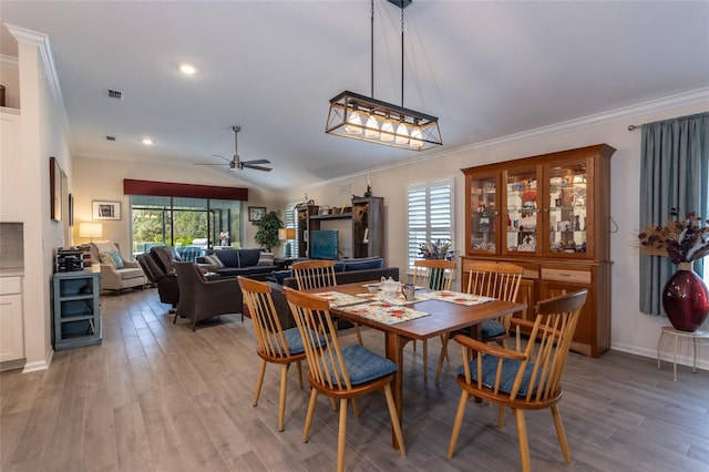 dining space featuring light wood-style flooring, recessed lighting, visible vents, a ceiling fan, and crown molding