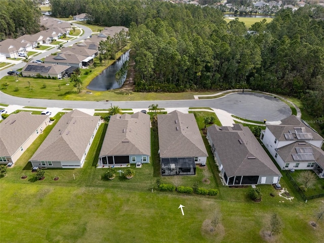 bird's eye view with a water view and a residential view