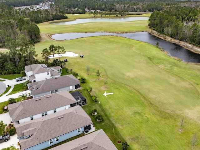 aerial view with a water view and view of golf course