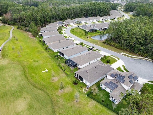 bird's eye view featuring a residential view and a forest view