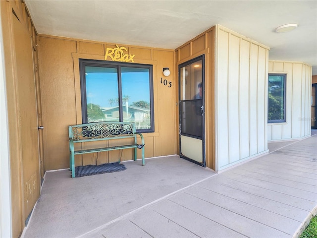 entrance to property featuring board and batten siding