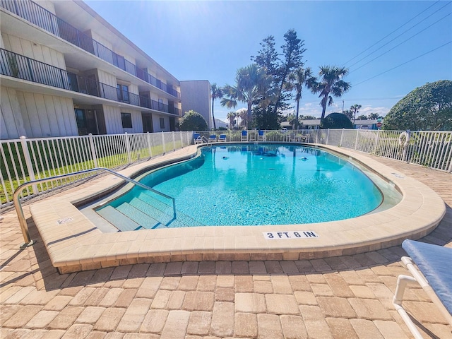 community pool with fence