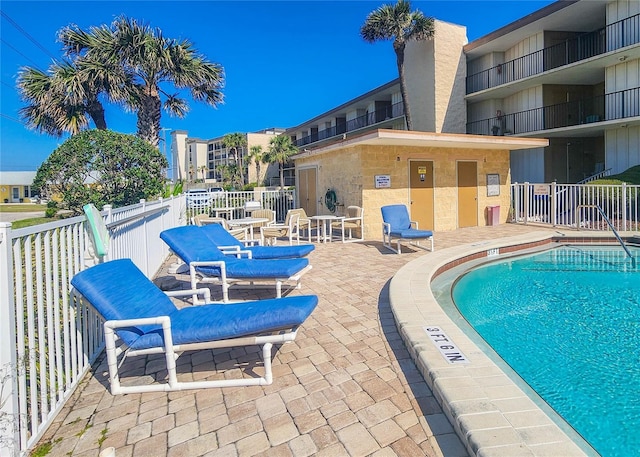 community pool with a patio