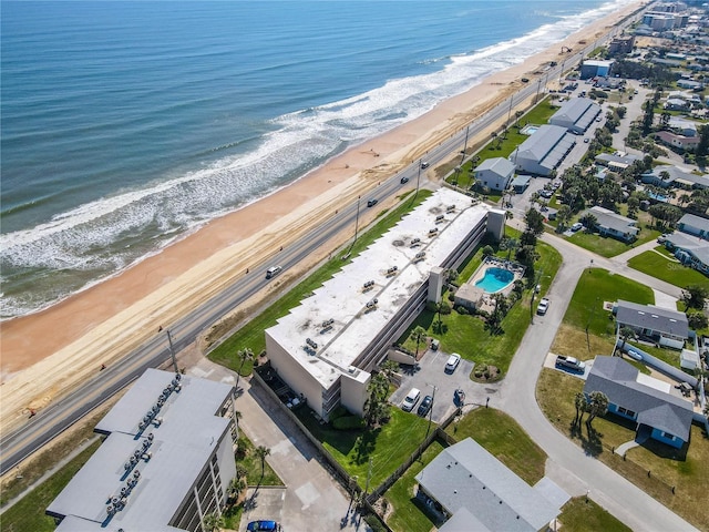 bird's eye view with a beach view and a water view