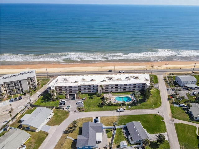 birds eye view of property featuring a view of the beach and a water view