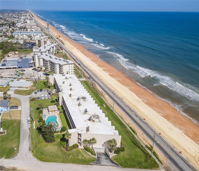 aerial view featuring a view of the beach and a water view