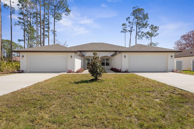 ranch-style home featuring driveway, an attached garage, a front yard, and stucco siding