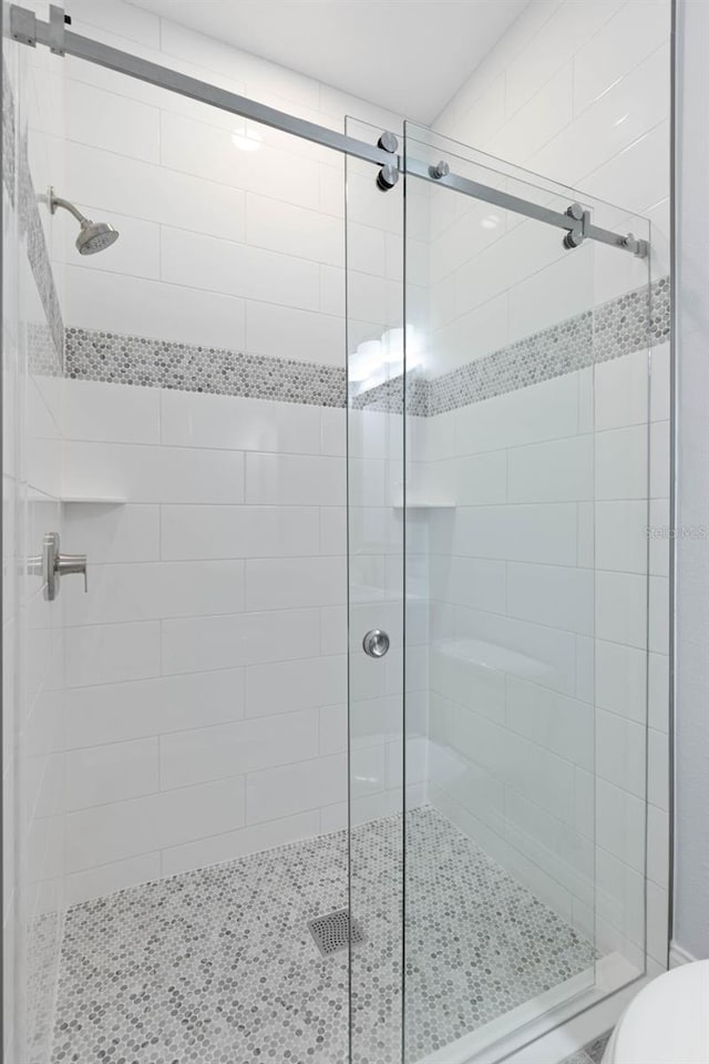 full bath with a shower stall