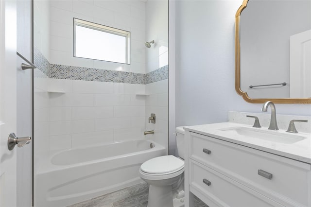 full bathroom with toilet, shower / bathing tub combination, and vanity