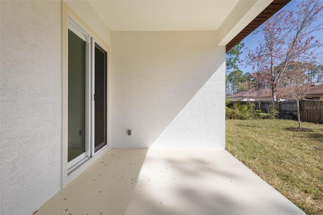 view of patio / terrace featuring fence