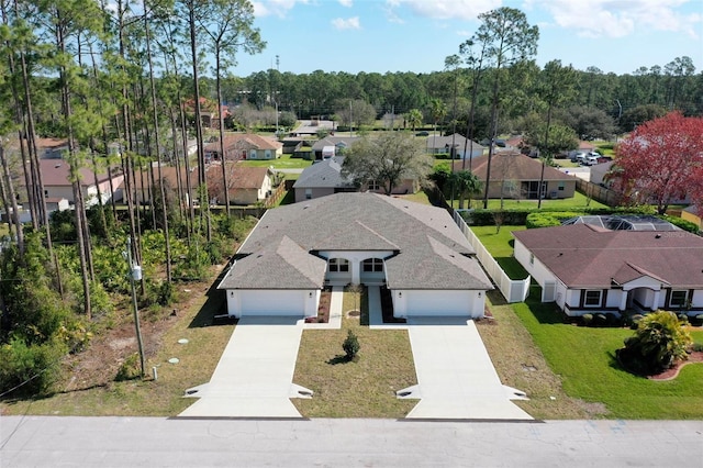 birds eye view of property with a residential view