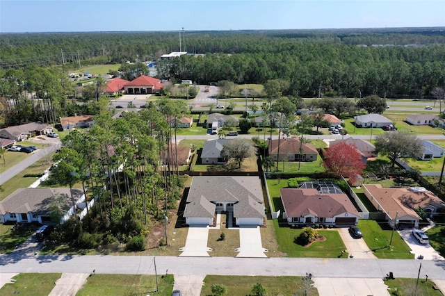 aerial view featuring a residential view and a view of trees