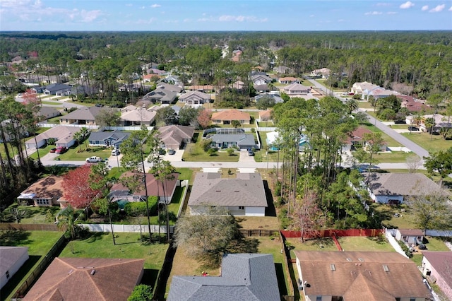 birds eye view of property with a residential view and a forest view