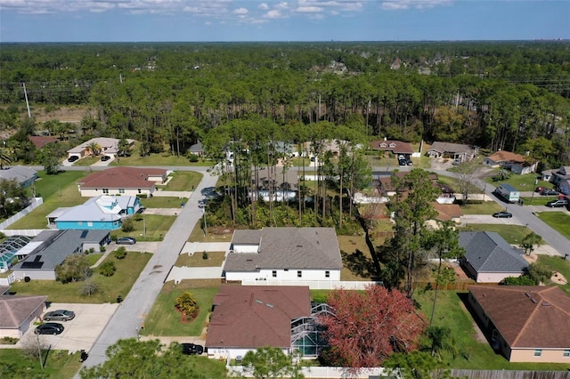 bird's eye view with a residential view and a view of trees