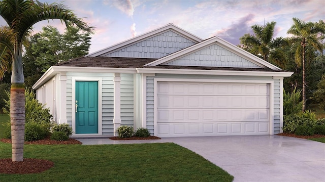 view of front of house featuring a garage, concrete driveway, and a yard