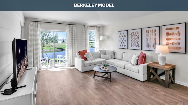 living room with wood finished floors and baseboards