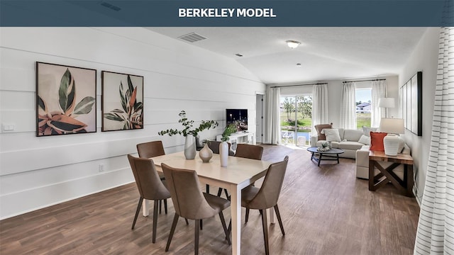 dining room with baseboards, visible vents, dark wood-style flooring, vaulted ceiling, and a textured ceiling