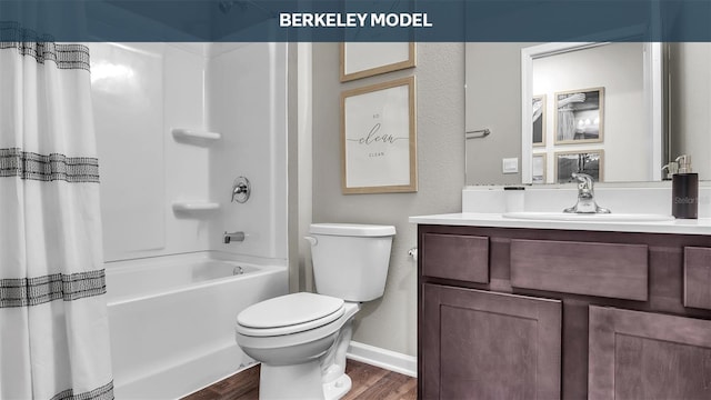 bathroom with toilet, shower / bath combo, vanity, wood finished floors, and baseboards