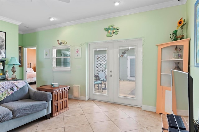 interior space featuring crown molding, light tile patterned floors, french doors, and baseboards