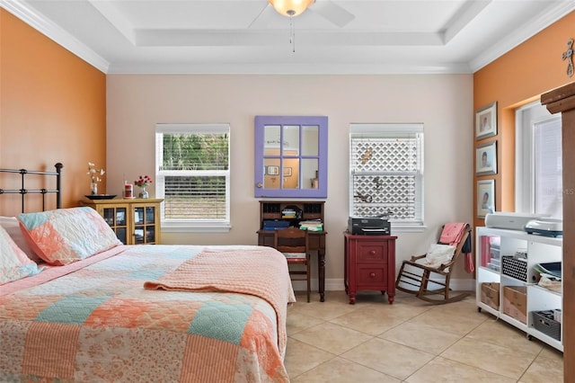 bedroom with light tile patterned floors, baseboards, crown molding, and a tray ceiling