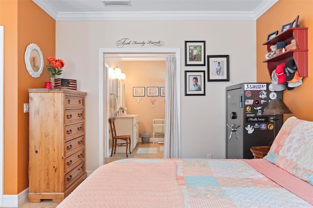 bedroom with visible vents, ensuite bath, crown molding, and baseboards