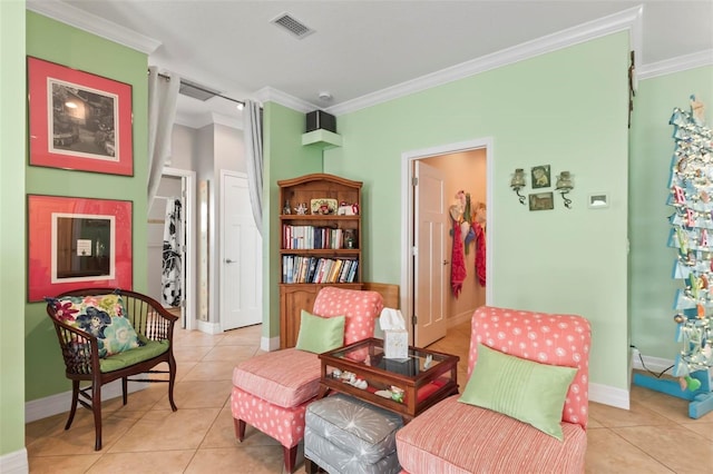 sitting room featuring light tile patterned flooring, baseboards, visible vents, and ornamental molding