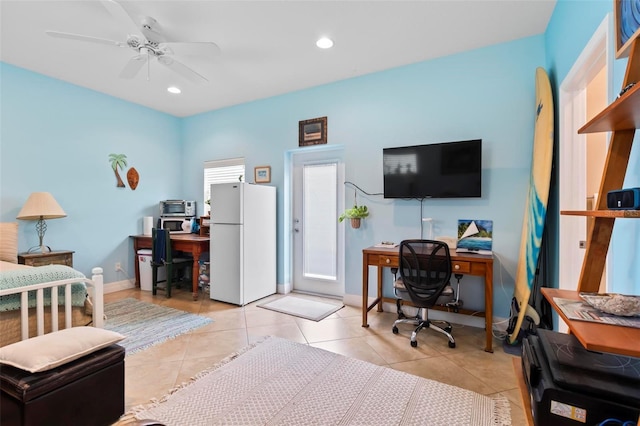 office space featuring recessed lighting, baseboards, light tile patterned flooring, and a ceiling fan