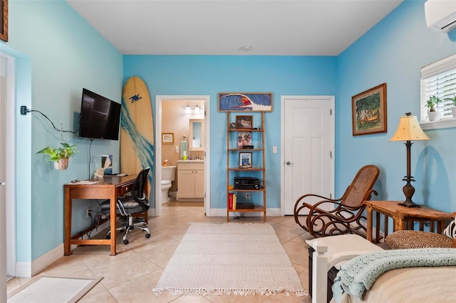 office area featuring baseboards, light tile patterned flooring, and a wall unit AC
