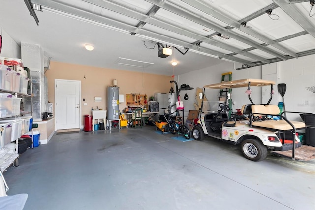 garage featuring a garage door opener, water heater, and a sink